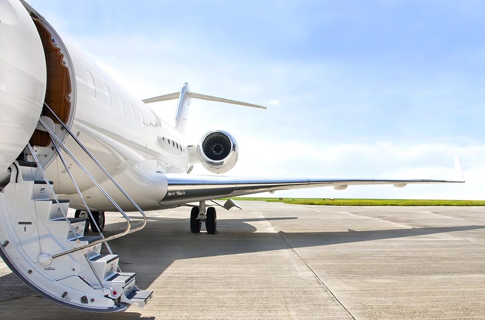 Private aircraft on the tarmac, representing property and asset management experience