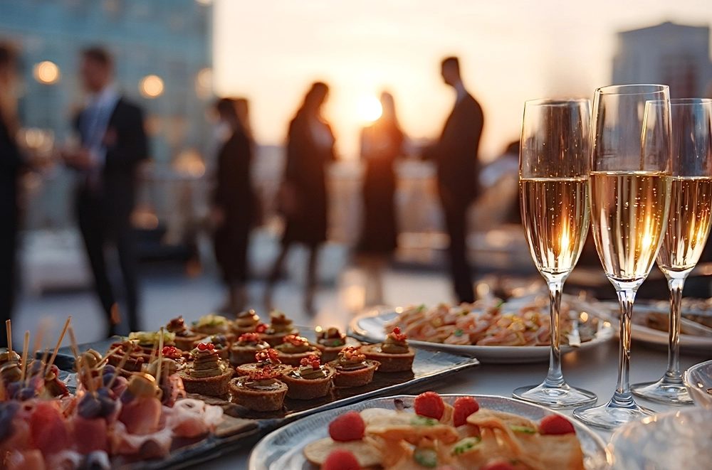 A rooftop reception with champagne and hors d’oeuvres at sunset — special projects and events